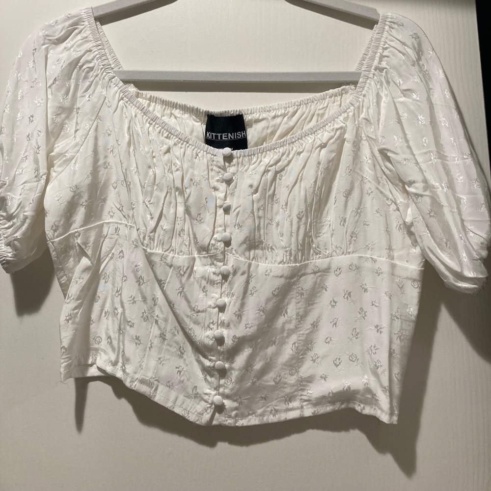 Kittenish white top